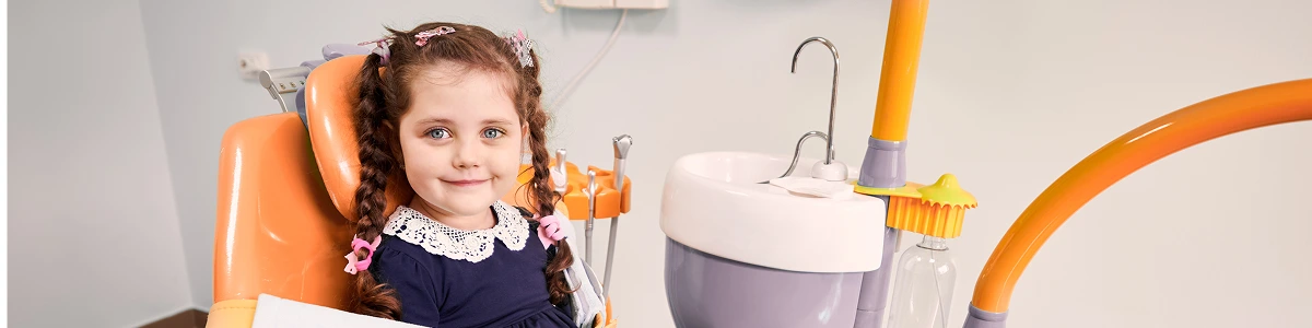 image adorable little girl sitting in dental chair